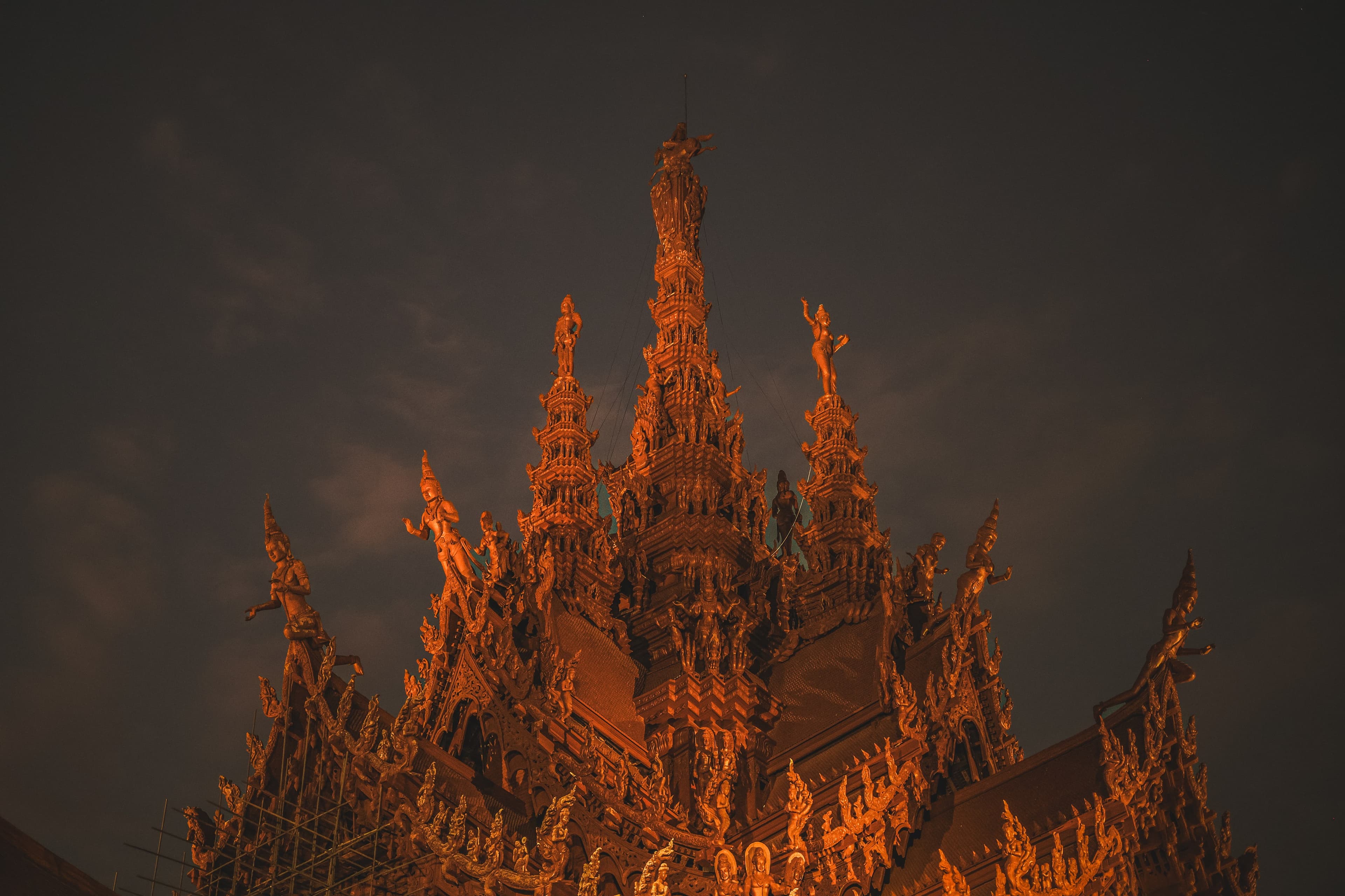 The Sanctuary of Truth's carved spire lit warm against the night sky.