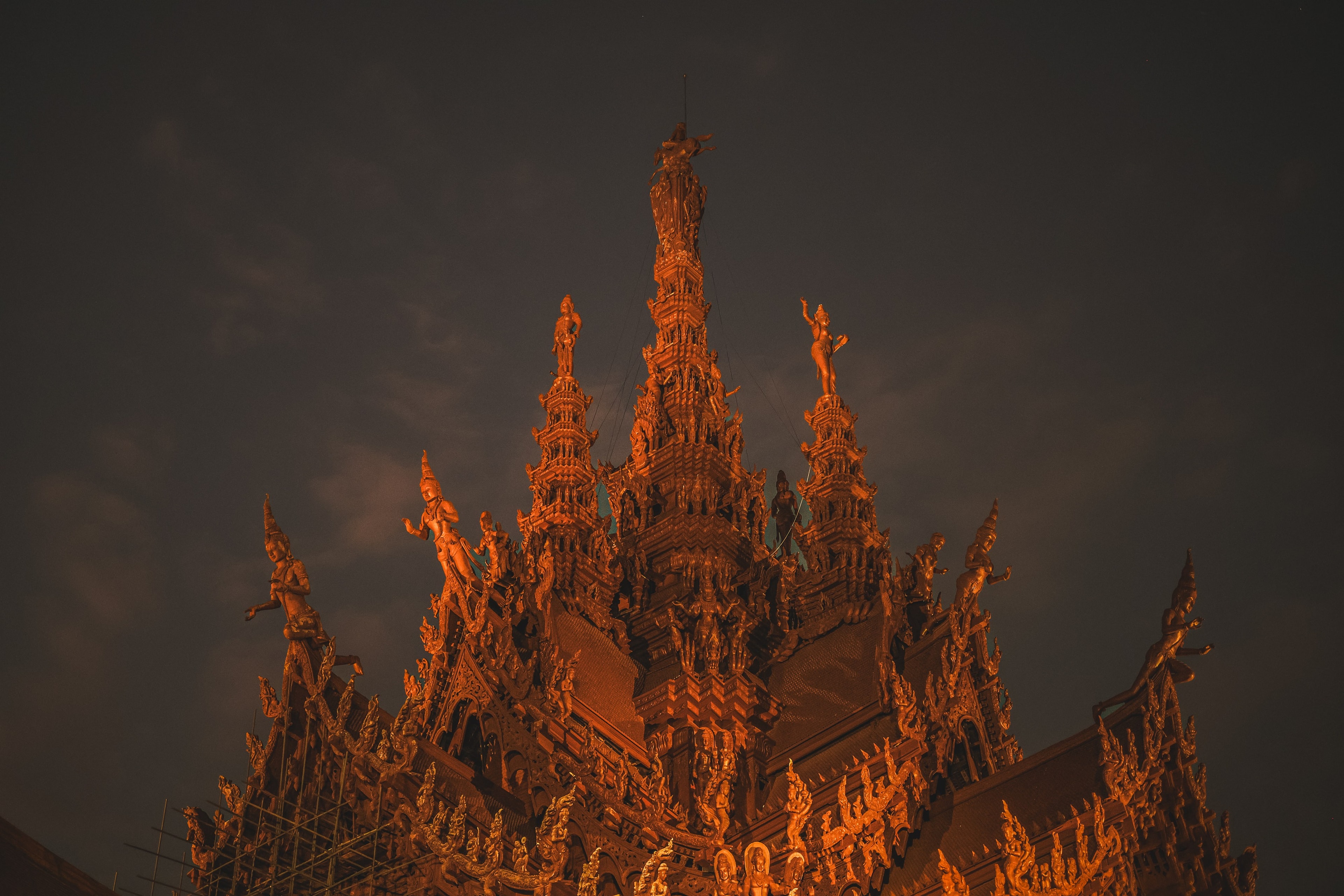 The Sanctuary of Truth's carved spire lit warm against the night sky.